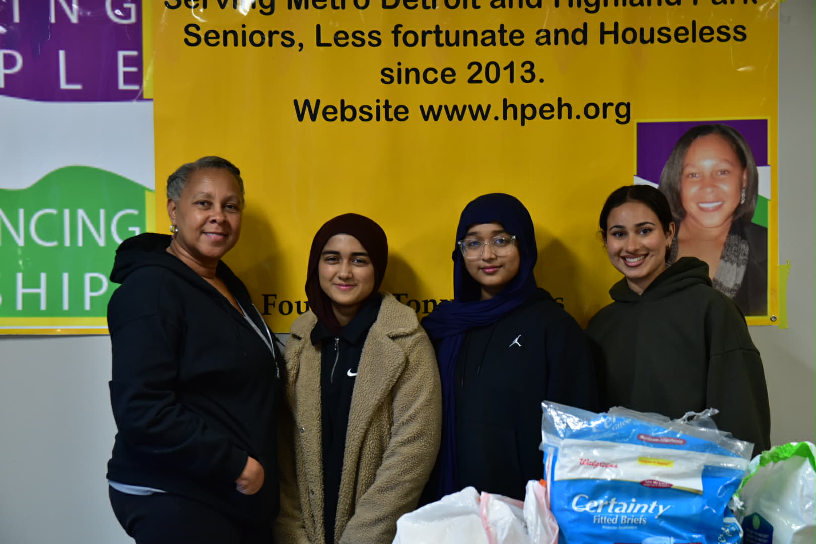 HPEH volunteers with hygiene supplies at a community outreach